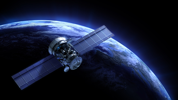 image d'un satellite en vol au-dessus de la Terre
